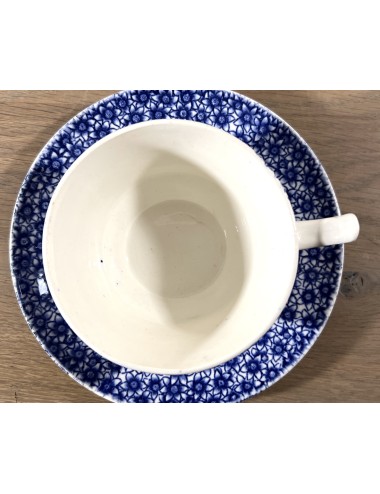 Cup and saucer - not marked but Petrus Regout - décor DUIVEN in blue with a 'devils ear'.