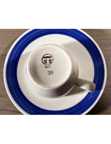 Cup and saucer - Torgau (GDR) - decoration with a blue band on a cream background