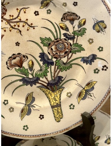 Plate / Decorative plate - Boch Frères - décor with a flower vase, bird and butterflies in yellow/green/blue