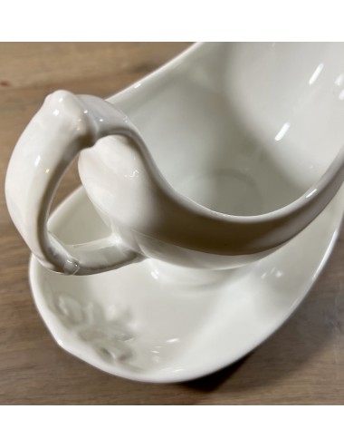 Gravy boat / Sauce bowl - unmarked - in white and rather wide running model with a pointed saucer