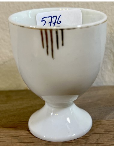 Egg cup - porcelain - unmarked - executed with transverse gold lines