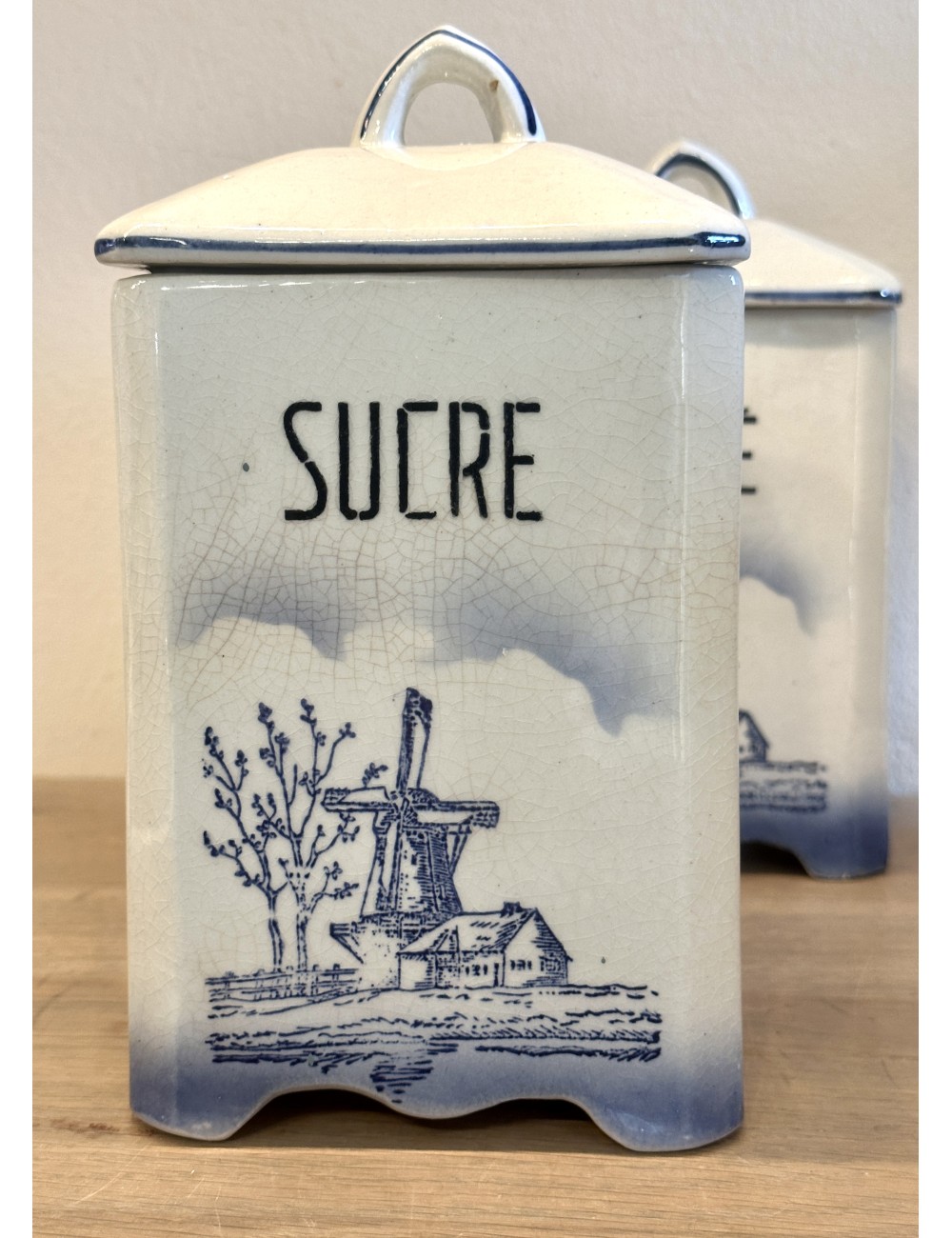 Storage jar - unmarked - décor in blue/white of a mill, house and trees - inscription SUCRE