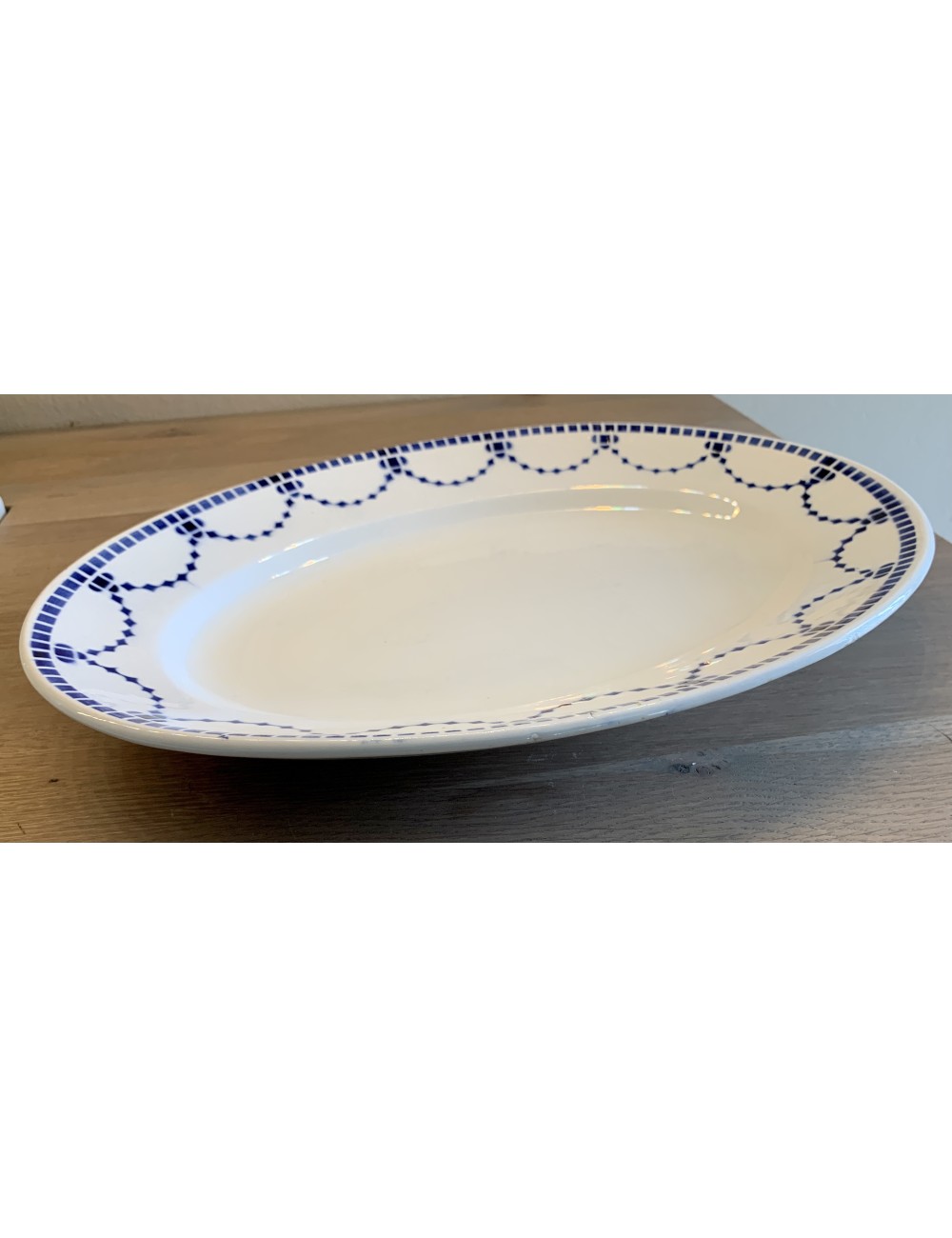 Platter – oval – Saint Ghislain – décor blue border with geometric figures.