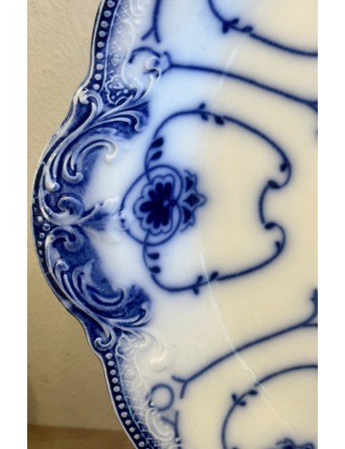 Plate - round model - English, F.B.? - décor in flowing blue with scalloped rim and ears