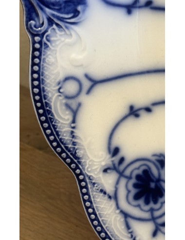 Plate - round model - English, F.B.? - décor in flowing blue with scalloped rim and ears