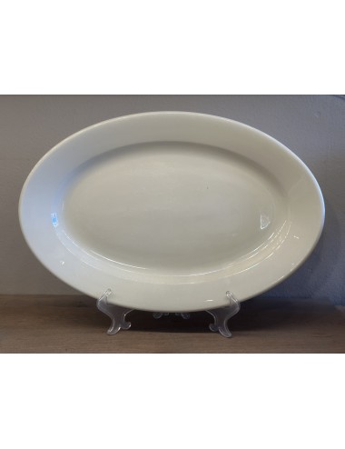 Plate - flat oval larger model - Petrus Regout - executed in cream colored porcelain