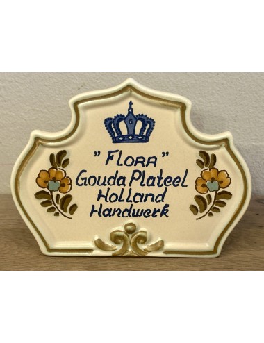 Store advertising / Shop display for "FLORA" GOUDA PLATEEL HOLLAND HANDWORK - light brown background