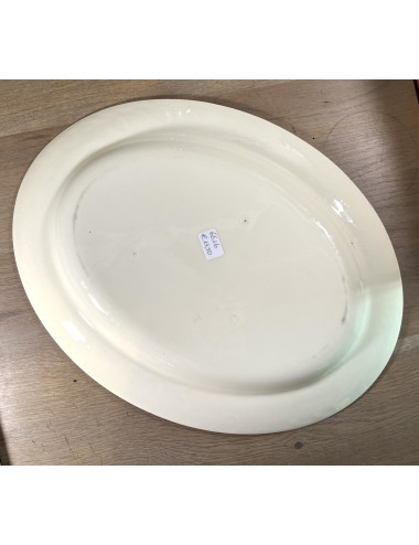 Plate - large model - unmarked (Boch?) - executed in all beige color