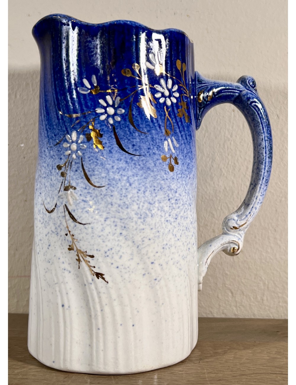 Jug - smaller model - Societe Ceramique Maestricht - slightly torsioned model with a color going from white to royal blue