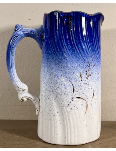 Jug - smaller model - Societe Ceramique Maestricht - slightly torsioned model with a color going from white to royal blue