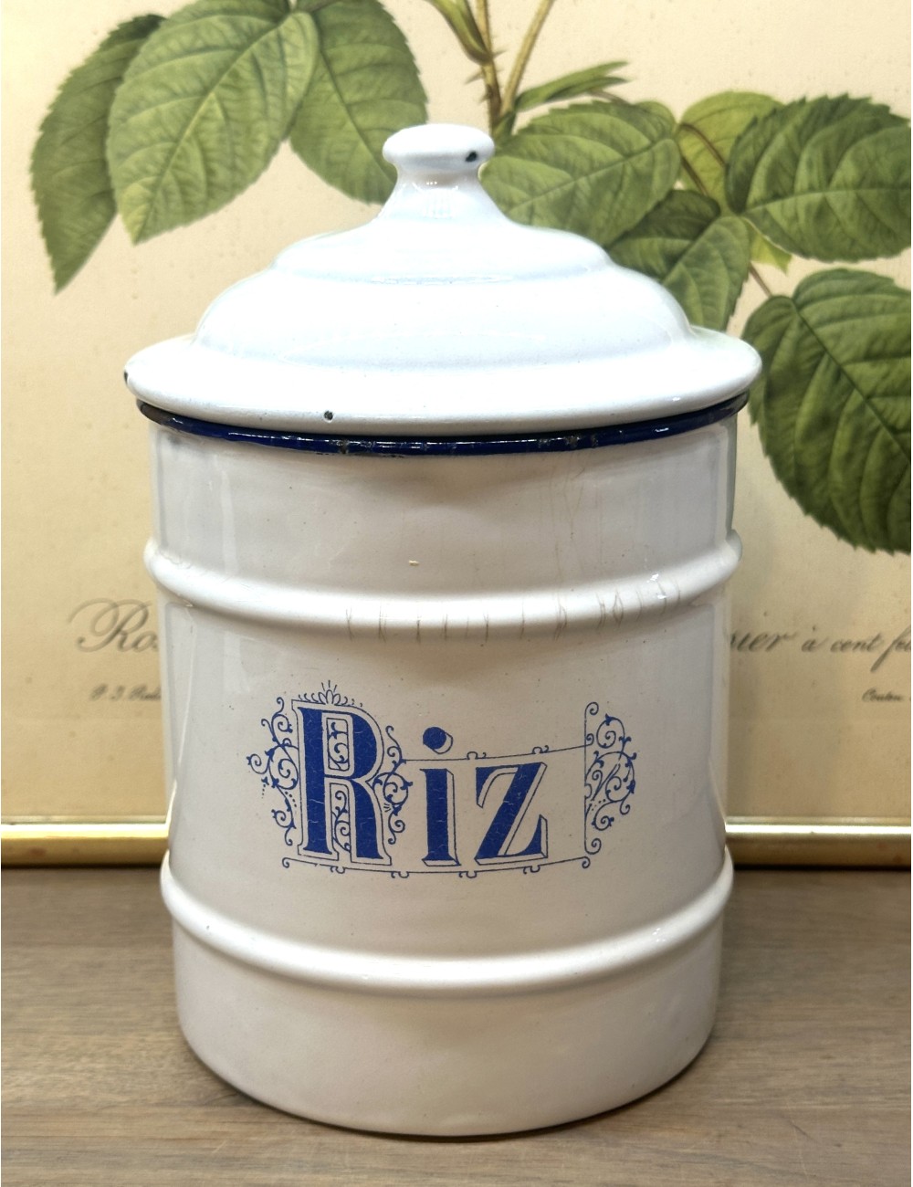 Storage tin of white enamel with inscription RIZ (rice) in lighter blue