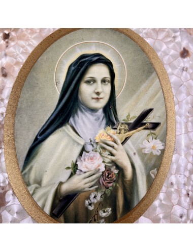 Plastic frame with image of Saint Theresa