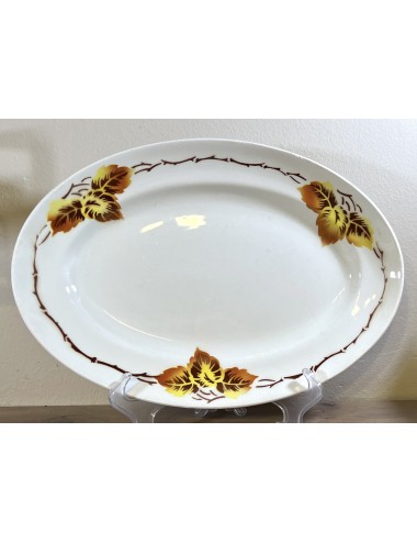 Plate - oval model - Moulin des Loups / Orchies - décor of autumn leaves in shades of brown and yellow