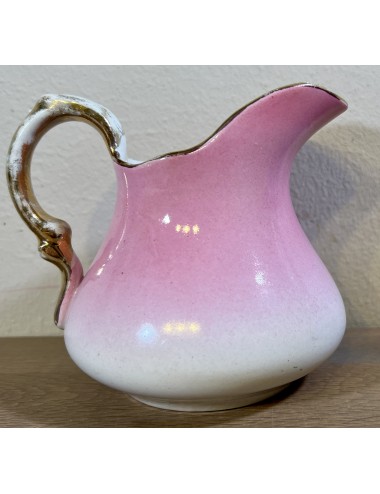 Milk jug - Petrus Regout - décor in cream color overflowing into pink color with gold color rim and handle
