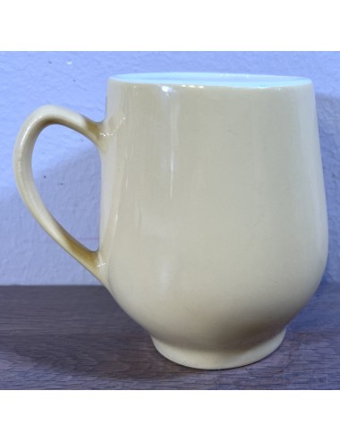 Milk cup / Soup cup - so called convex belly cup - Sphinx Regout - ochre yellow pastel